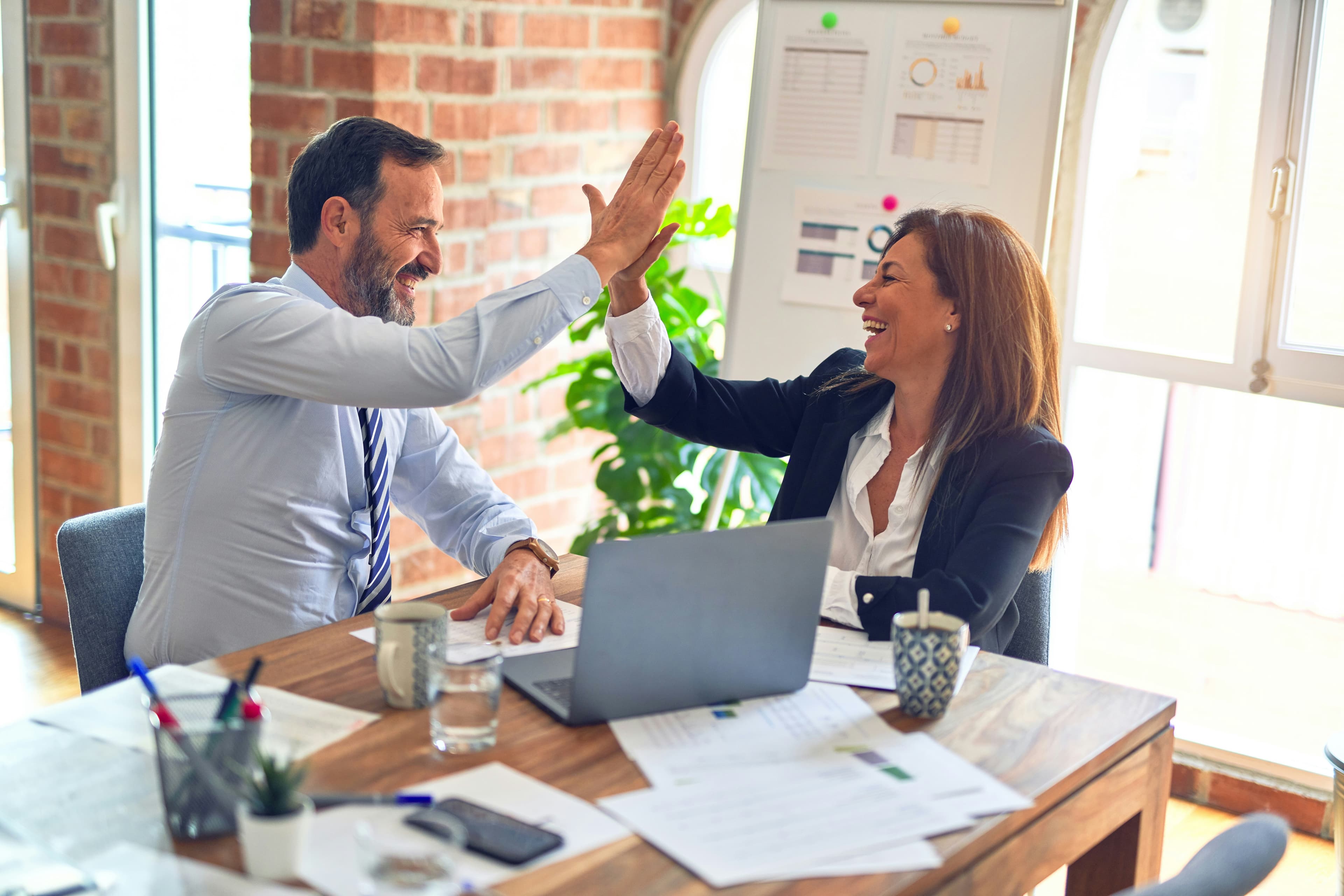 Diverse team meeting at a Canadian small business with strong workplace benefits